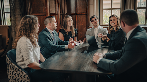 Team Sitting At Table Having Discussion